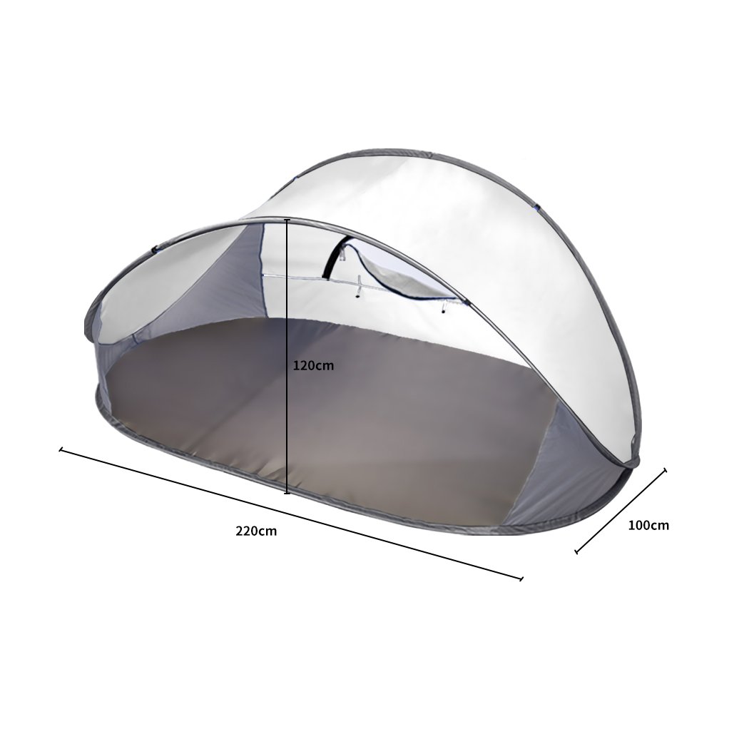 Mountvie Pop Up Tent set up at the beach, spacious enough for four people, featuring a grey color and interwoven mesh for ventilation.